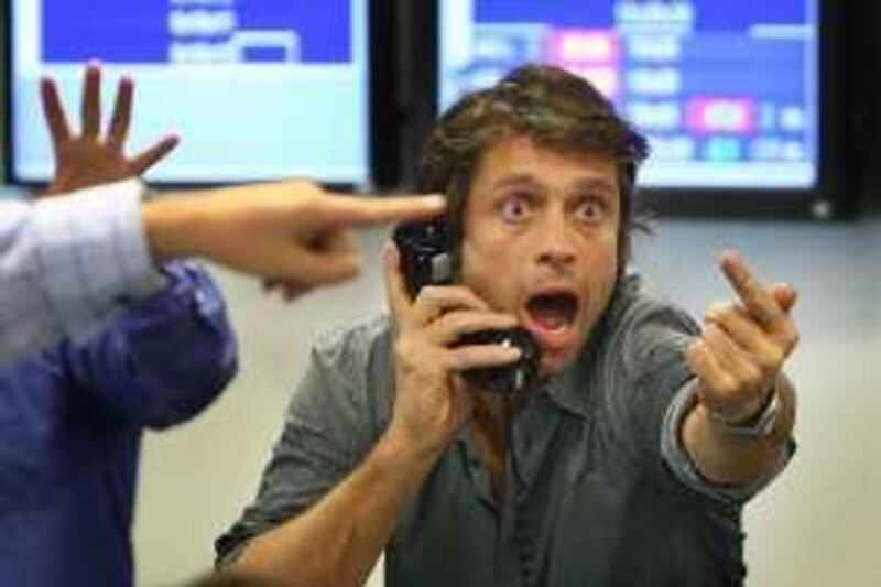 LONDON - OCTOBER 09:  A broker on ICAP's dealing floor calls for prices on October 9, 2008 in London, England.  Share prices are up on the day as markets react to the interest rate cut.  (Photo by Peter Macdiarmid/Getty Images)