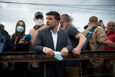 Ukrainian President Volodymyr Zelenskiy visits a settlement affected by heavy rainfall and flooding in Ivano-Frankivsk Region, Ukraine June 25, 2020. Picture taken June 25, 2020. Ukrainian Presidential Press Service/Handout via REUTERS ATTENTION EDITORS - THIS IMAGE WAS PROVIDED BY A THIRD PARTY.