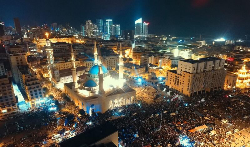 An areal view taken shows Lebanese protesters rallying in downtown Beirut, on the fifth day of demonstrations against tax increases and official corruption. AFP