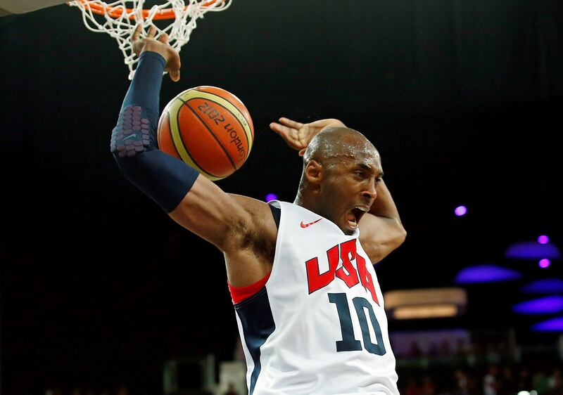 FILE PHOTO: Kobe Bryant of the U.S. dunks against Spain during their men's gold medal basketball match at the North Greenwich Arena in London during the London 2012 Olympic Games August 12, 2012.           REUTERS/Mike Segar/File Photo