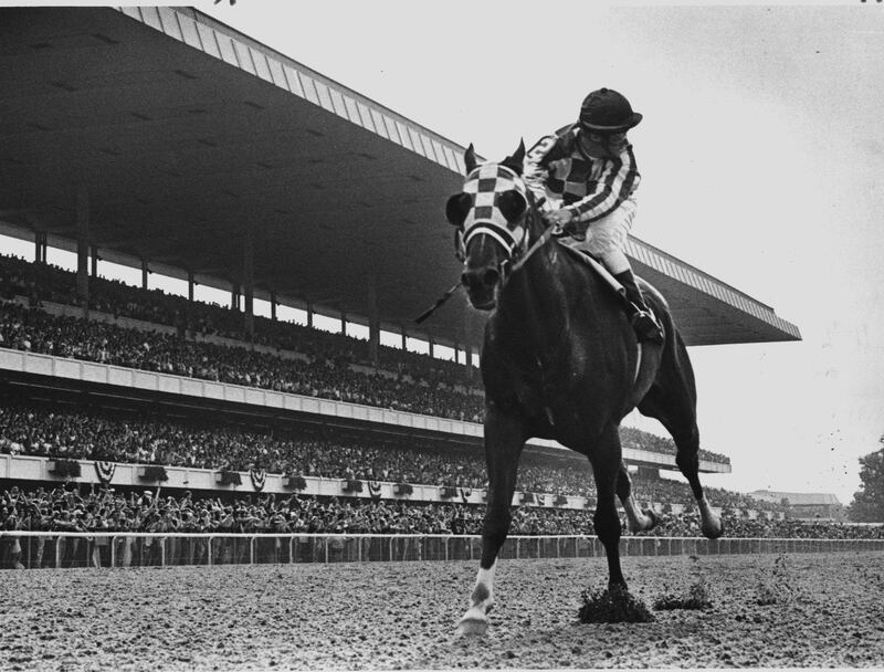 Elmont, N.Y.: Jockey Ron Turcotte aboard Secretariat looks behind for the other horses on his way to a 31-lengths victory in the Belmont Stakes in Elmont, New York on June 9, 1973, to complete the first Triple Crown in 25 years. Over 69,000 spectators in the grandstand witnessed history being made. (Photo by Joe Dombroski/Newsday RM via Getty Images)