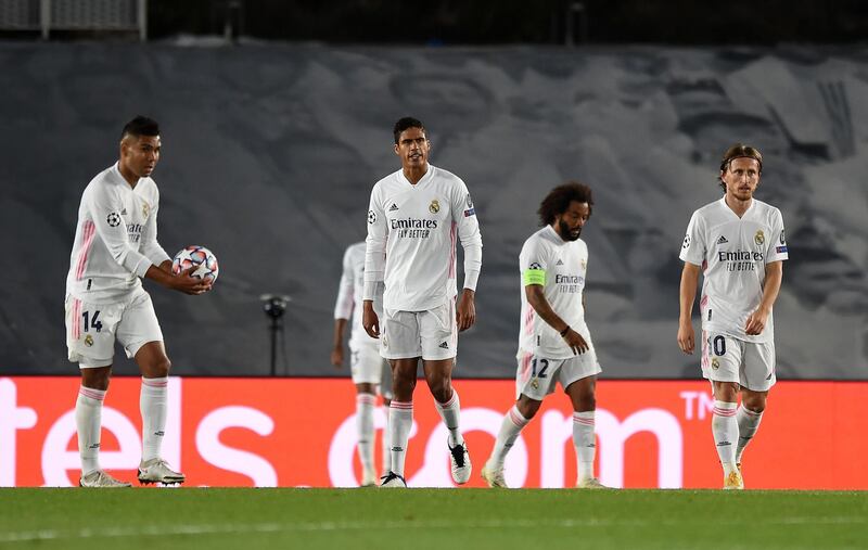 Marcelo, Raphael Varane and Luka Modric of Real Madrid look dejected after conceding a third goal. Getty