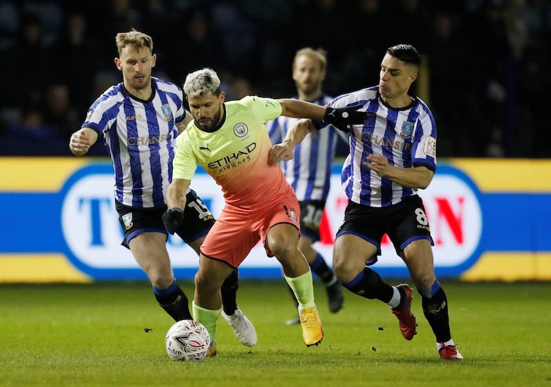 Sergio Aguero under pressure from Wednesday players. Reuters