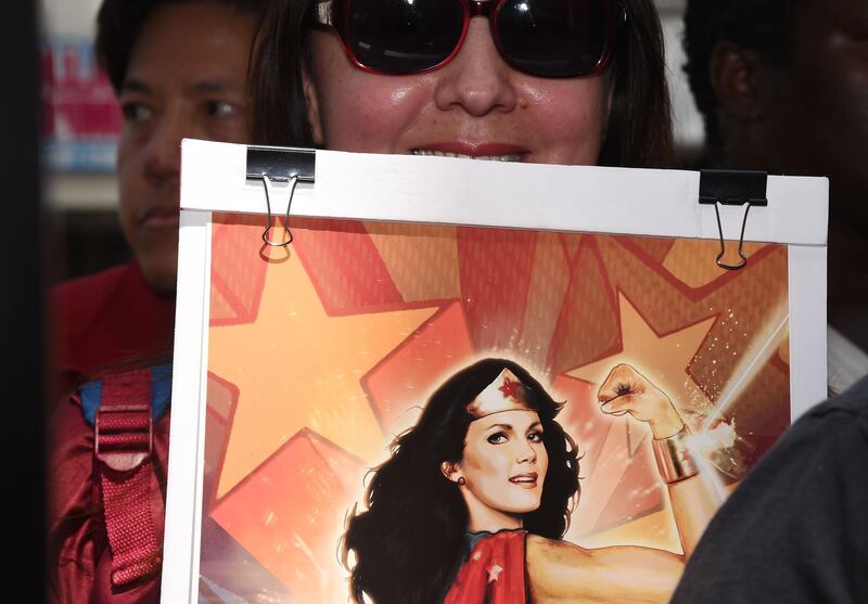 Fans wait to meet actress Lynda Carter at her star unveiling ceremony on the Hollywood Walk of Fame. Robyn Beck / AFP