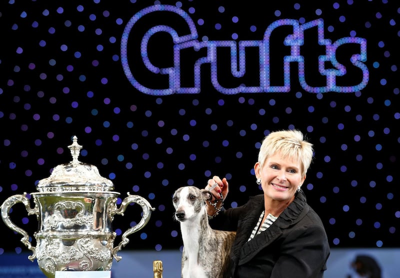 Tease, a Whippet, stands with owner Yvette Short after winning the best in show during the final day of the Crufts Dog Show. Darren Staples / Reuters