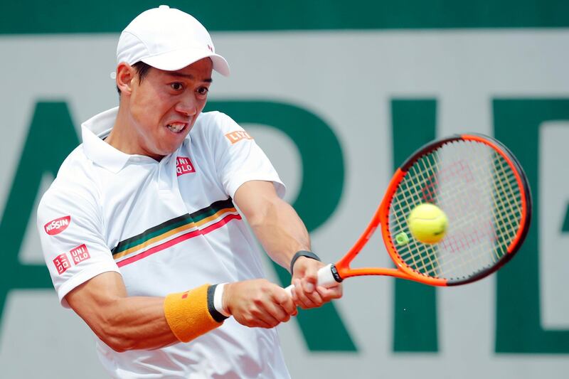 FILE - In this Monday, June 5, 2017 file photo, Japan's Kei Nishikori returns the ball to Spain's Fernando Verdasco during their fourth round match of the French Open tennis tournament at the Roland Garros stadium in Paris. Kei Nishikori's agent says the 2014 U.S. Open runner-up is pulling out of the Australian Open. Olivier van Lindonk says in an email Wednesday, Jan. 3, 2018 that Nishikori is not ready to play best-of-five-set matches as he returns from an injured right wrist that has sidelined him since August. (AP Photo/Christophe Ena, File)