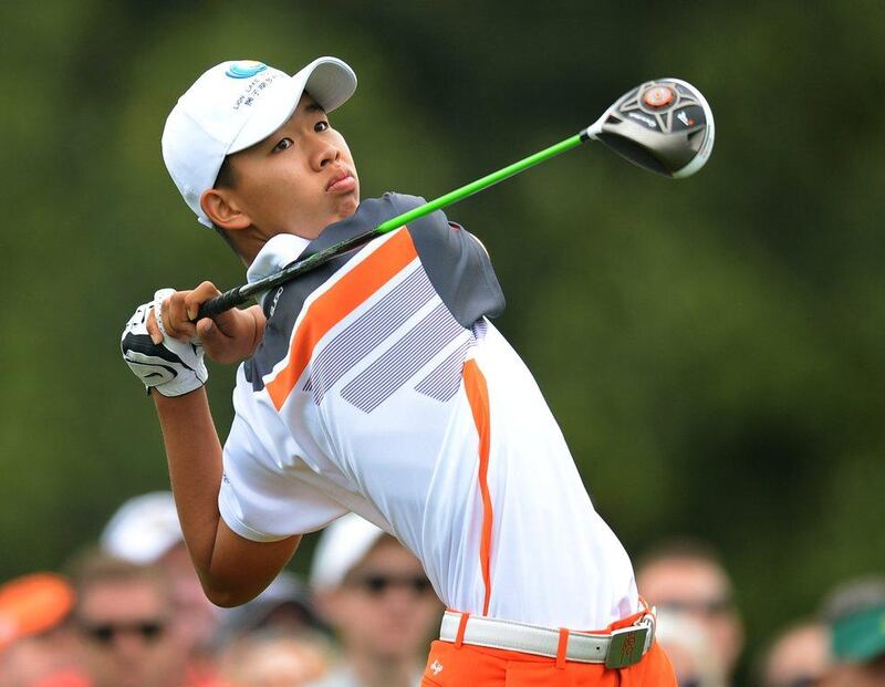 Guan Tianlang made the cut at the Masters this year at just 14 years of age. Jim Watson / AFP