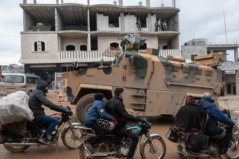 IDLIB, SYRIA - FEBRUARY 22: Turkish Military's armoured vehicles that crossed to Syria drive pass in a road in village of Aaqrabate on February 22, 2020 in Idlib, Syria. Turkeys President Recep Tayyip Erdogan in a speech Tuesday threatened, imminent operations in Syrias Idlib if Damascus fails to withdraw behind Turkish positions The threat comes after Syrias government and its ally Russia rejected demands to pull back to ceasefire lines agreed upon in the 2018 Sochi accord. More than 900,000 civilians have been displaced by fighting in or around Idlib since December 1. Idlib is the last rebel stronghold of fighters trying to overthrow Syrian President Bashar al-Assad and in the past years has become the last safe haven for civilians displaced by fighting in other areas of Syria, its population has doubled to close to three million people, many of whom are now fleeing the government offensive towards overcrowded camps close to the Turkish border amid freezing conditions, creating a humanitarian disaster. (Photo by Burak Kara/Getty Images)