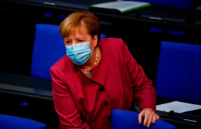 German Chancellor Angela Merkel wears a face mask as she takes her seat to attend a session of the German lower house of parliament Bundestag in Berlin on September 30, 2020.  / AFP / Tobias SCHWARZ
