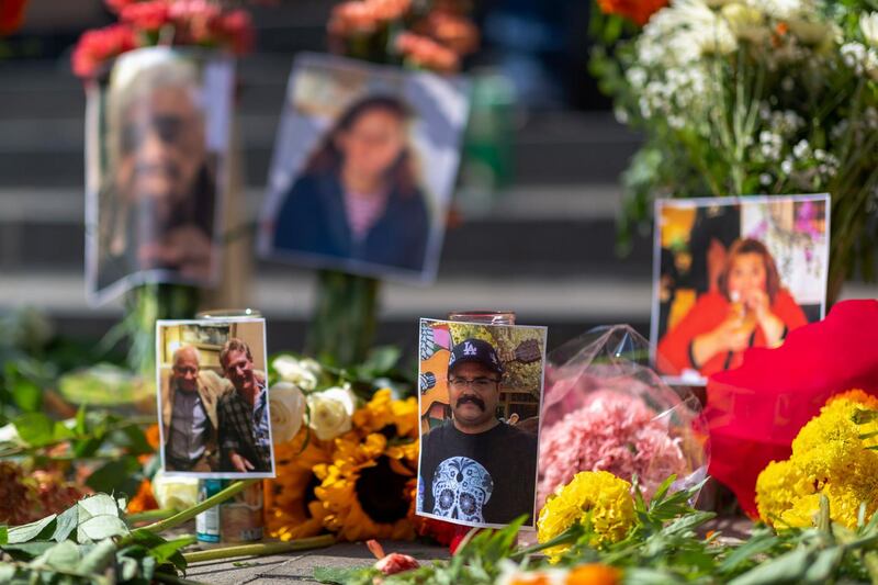 Photos of some of the deceased are seen at a memorial ceremony held by loved ones of mostly Latino essential workers who are among the more than 5,700 Angelinos who died of Covid-19 in Los Angeles, California. EPA