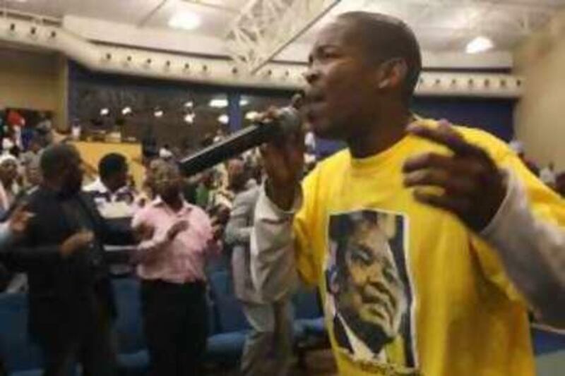 At Rosebank Union Church, a singer in a Mosiuoa 'Terror' Lekota T-shirt warms up the crowd into a revivalist atmosphere ahead of an address by the ANC dissident and former party chairman.

Credit: Sebatien Berger/The National *** Local Caption ***  lek1.jpg