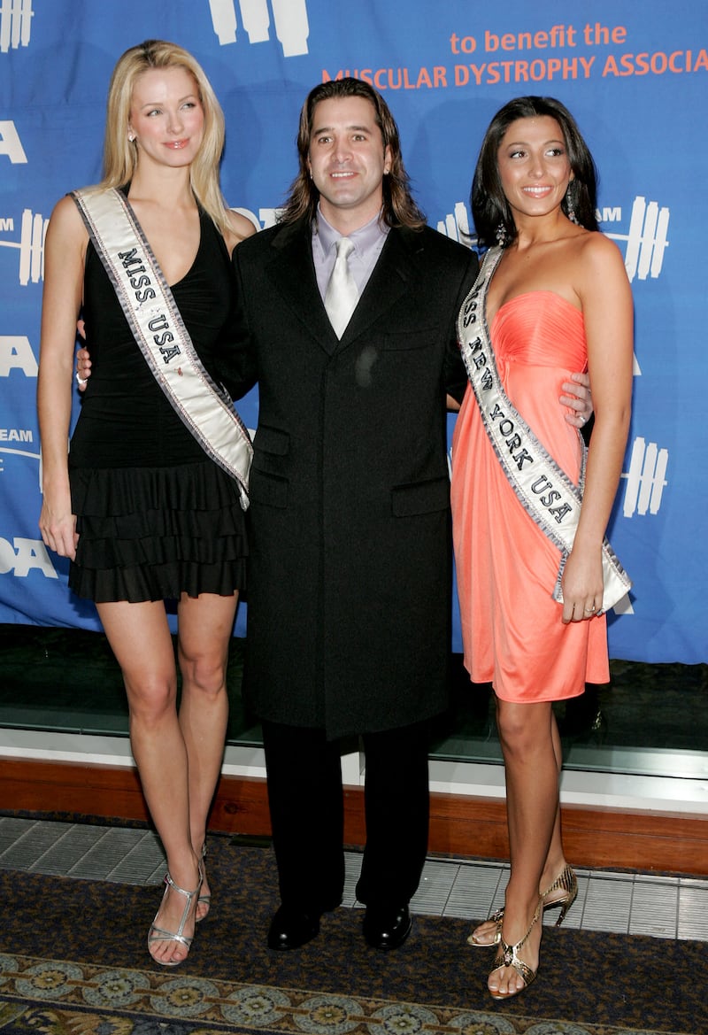 Musician Scott Stapp, centre, then Miss USA Shandi Finnessey and Miss New York Jaclyn Nesheiwat at the 8th annual Muscular Dystrophy Association's Muscle Team 2005 Gala at Chelsea Pier's in New York City. Getty Images