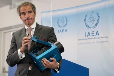 IAEA chief Rafael Grossi holds a surveillance camera at the agency's headquarters. The UN body says it has been unable to monitor Iran's activities. AP 