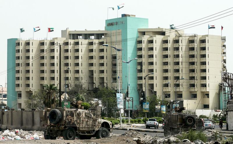 Emirati military vehicles driving outside the Aden Hotel. AFP