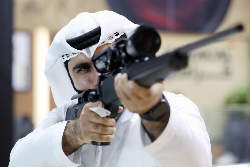 Falah Alblooshi looks down the sight of a Liwa Arms Chayeh Z20 on the first day of the Abu Dhabi International Hunting and Equestrian Exhibition, or Adihex 2023, at Adnec in Abu Dhabi. Chris Whiteoak / The National