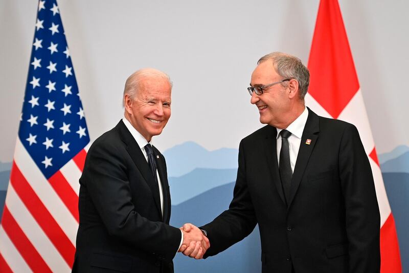 Joe Biden and Swiss president Guy Parmelin shake hands in Geneva. AP Photo