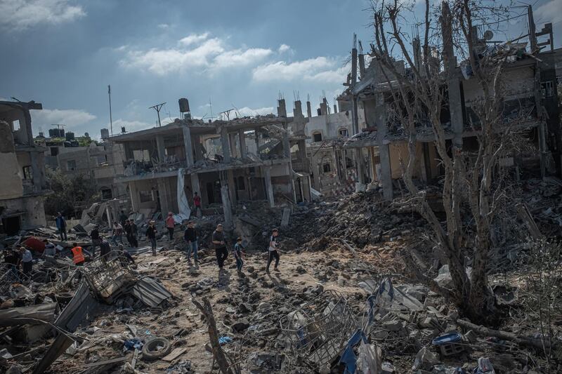 People inspect the damage done to Beit Hanoun after a night of Israeli raids in Gaza City, Gaza. Getty Images