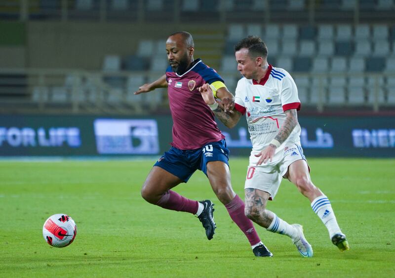 Ismail Matar, left, and Bernard tussle for possession during Sharjah’s 2-1 win over Al Wahda in the Adnoc Pro League at Al Nahyan stadium on Friday. PLC