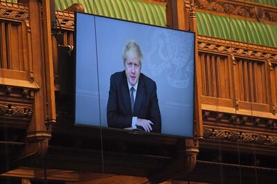 epa08827833 A handout photo made available by the UK Parliament shows Britain's Prime Minister Boris Johnson on a large screen as he takes part virtually in the Prime Minister's Questions (PMQs) in the House of Commons at Parliament in London, Britain, 18 November 2020. British Prime Minister Boris Johnson, who battled a coronavirus infection earlier this year, is self-isolating after having been exposed to the coronavirus again  EPA/JESSICA TAYLOR / UK PARLIAMENT / HANDOUT MANDATORY CREDIT: JESSICA TAYLOR / UK PARLIAMENT HANDOUT EDITORIAL USE ONLY/NO SALES
