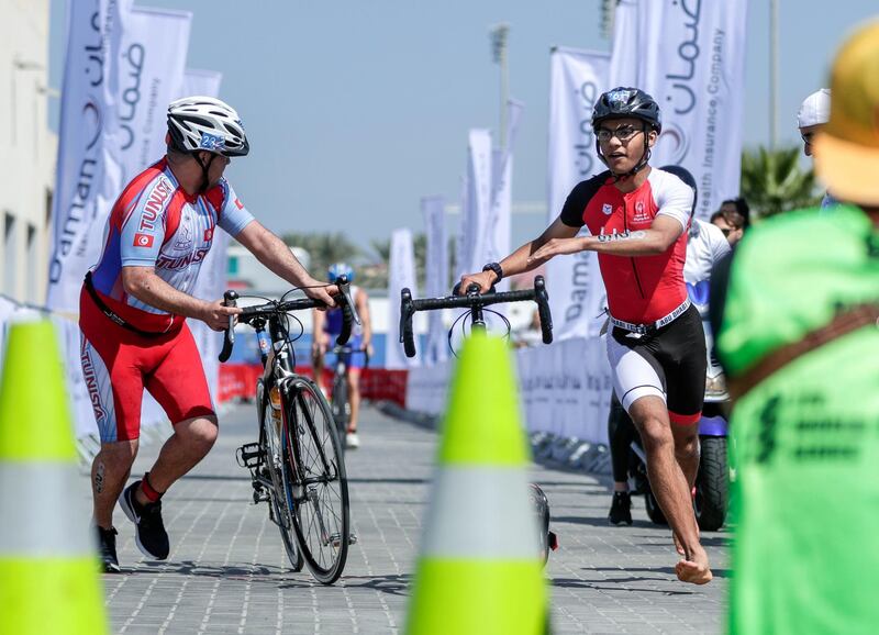 Abu Dhabi, United Arab Emirates, March 8, 2019.  Special Olympics ITU Traiathlon at the YAS Marina Circuit. -Micah Hambleton finishes the bike stage.
Besa/The National
Section:  NA
Reporter:  Haneen Dajani