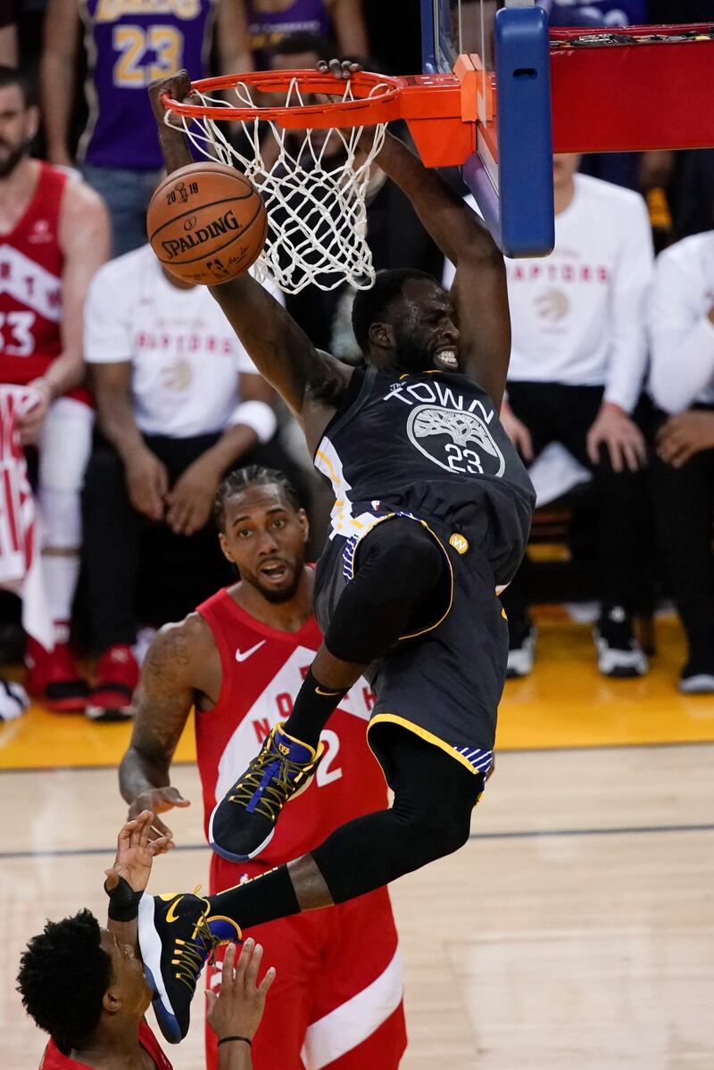 Golden State Warriors forward Draymond Green dunks against the Toronto Raptors during the first half of Game 6 of basketball's NBA Finals in Oakland, California. AP Photo