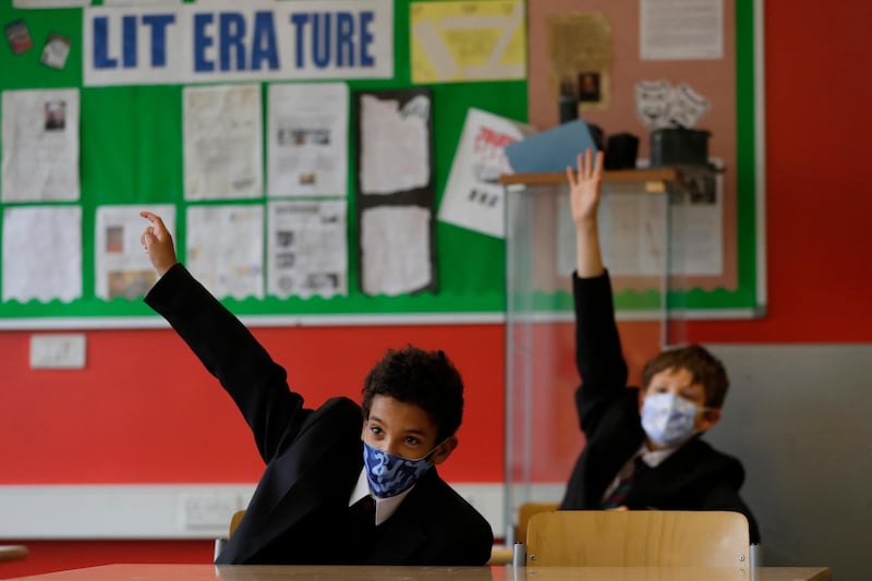 Year seven pupils in class during their first day at Kingsdale Foundation School in London in September 2020. Schools in England had started to reopen with special measures in place to deal with Coronavirus. AP Photo