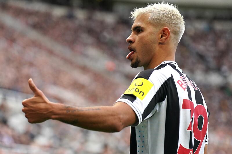 Bruno Guimaraes acknowledges the fans at St James' Park. PA