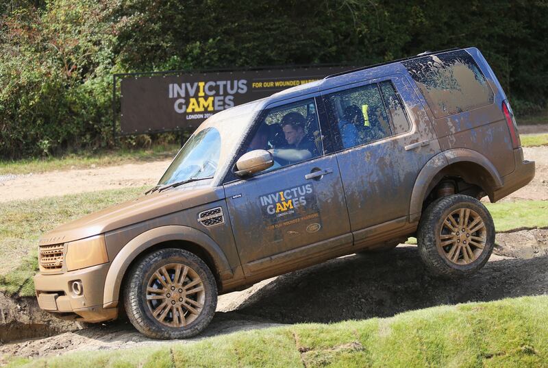 Prince Harry takes part in the Jaguar Land Rover Driving Challenge in 2014