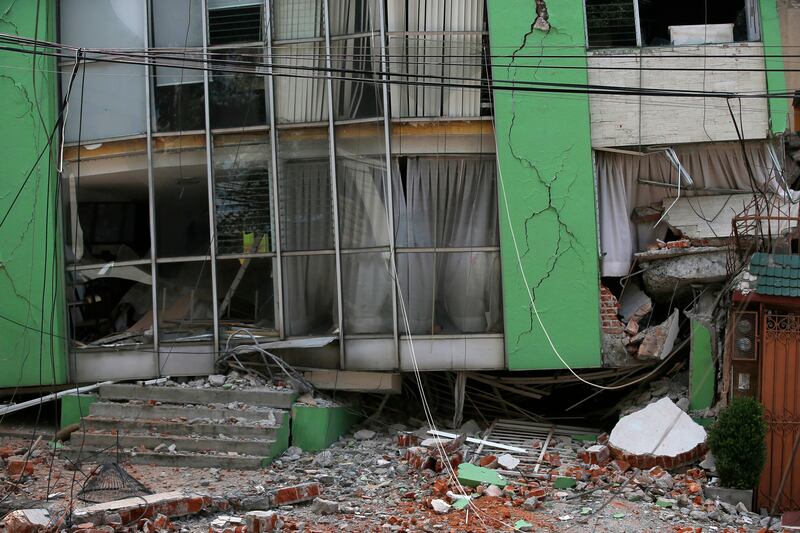 A collapsed building stands after an earthquake in the Narvarte neighborhood of Mexico City. Eduardo Verdugo / AP Photo