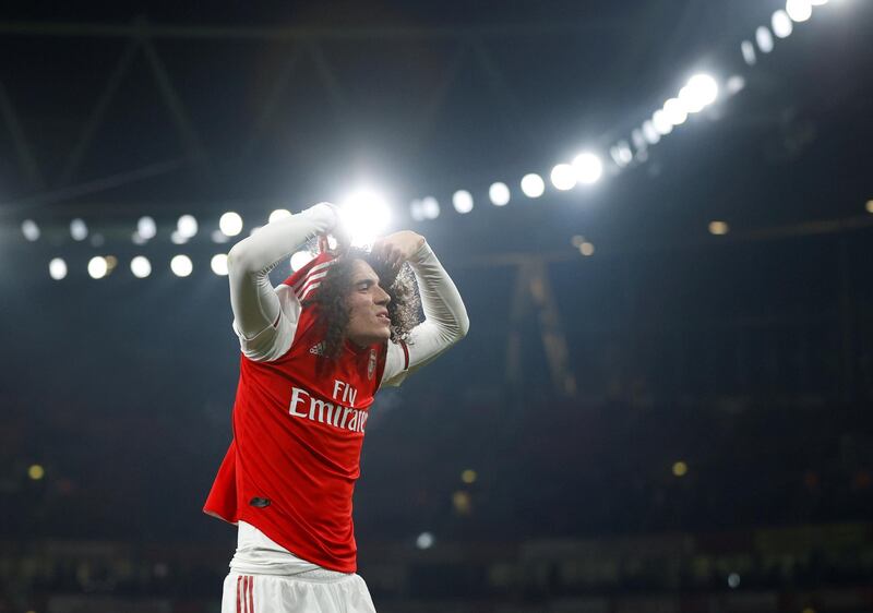 Arsenal's Matteo Guendouzi takes his shirt off after the match. Reuters