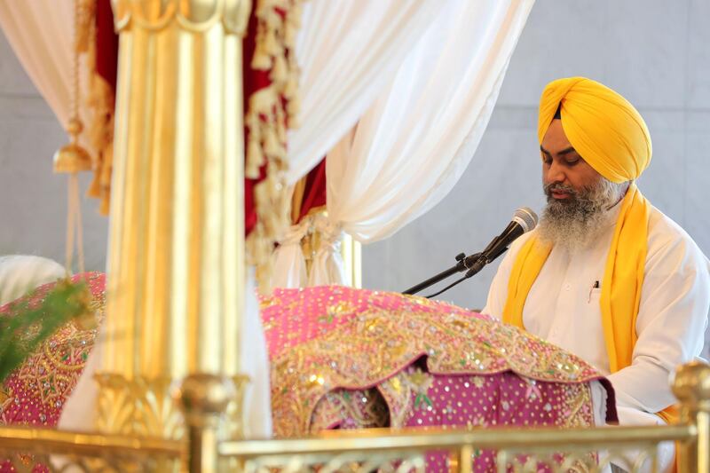 Dubai, United Arab Emirates - May 15, 2019: Members of the congregation pray. People take part in a multi faith Iftar at Gurunanak Darbar Sikh Gurudwara. Wednesday the 15th of May 2019. Jebel Ali, Dubai. Chris Whiteoak / The National