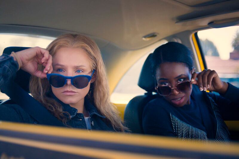 Kristen Bell, left, and Kirby Howell-Baptiste star in new comedy 'Queenpins'. STX Films
