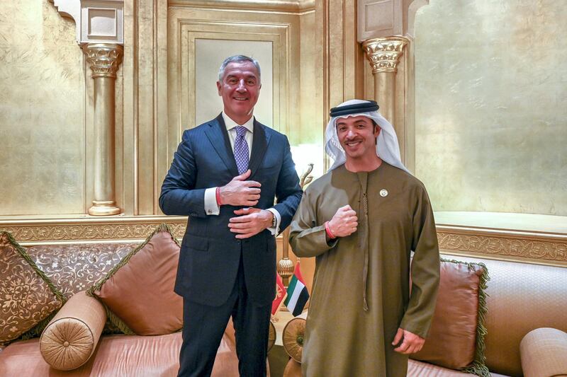 ABU DHABI, UNITED ARAB EMIRATES - January 15, 2019: HH Sheikh Hazza bin Zayed Al Nahyan, Vice Chairman of the Abu Dhabi Executive Council (R) and HE Milo Djukanovic, President of Montenegro (L) stand for a photograph wearing the Special Olympics World Games Abu Dhabi 2019 wrist band, at the Emirates Palace.
( Saeed Al Neyadi / Ministry of Presidential Affairs )
---