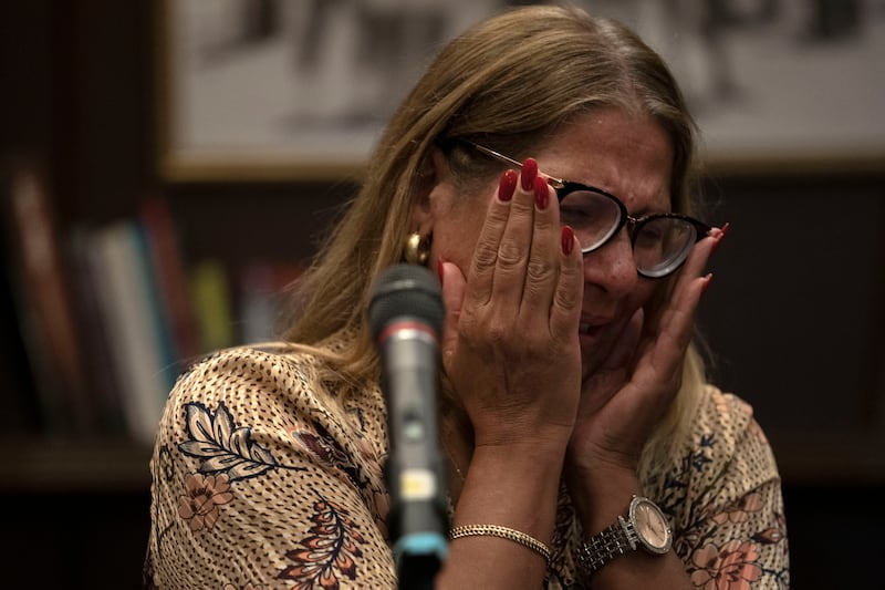 A relative of an Israeli missing since the attack by Hamas militants near the Gaza border sheds tears during a press conference in Ramat Gan, Israel. AP