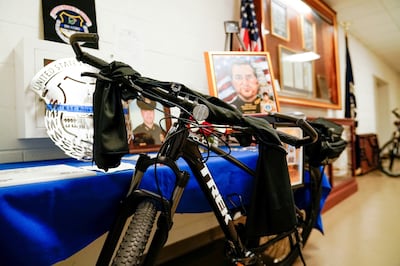 The bicycle that belonged to Capitol policeman Brian Sicknick, who died a day after battling to disperse the January 6 rioters, is displayed as part of a memorial to him, at the Capitol, in Washington. Reuters