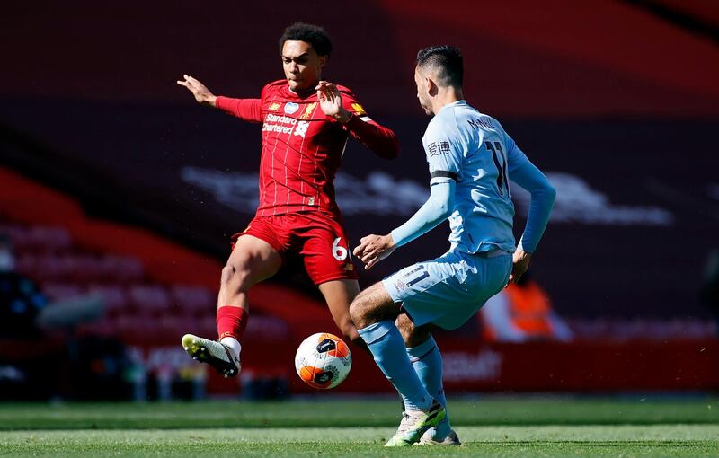 Liverpool's Trent Alexander-Arnold and Burnley's Dwight McNeil battle for the ball. PA