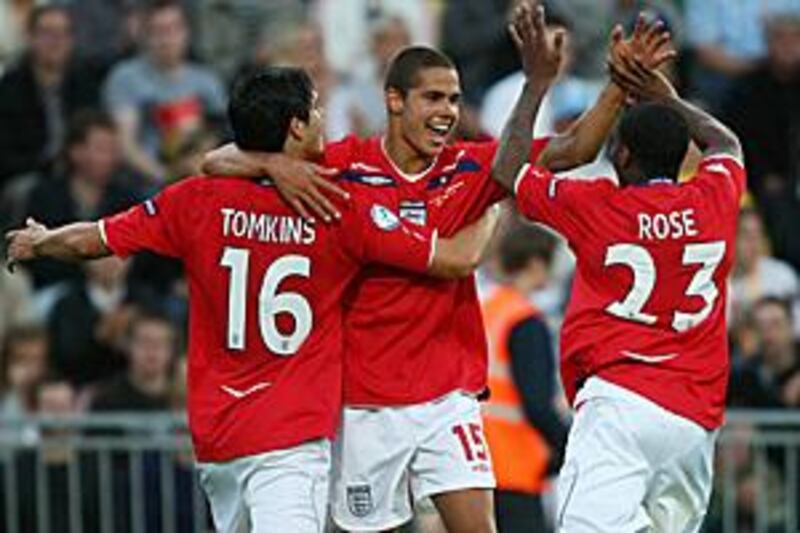 England's Jack Rodwell, centre, celebrates with his teammates James Tomkins and Danny Rose.