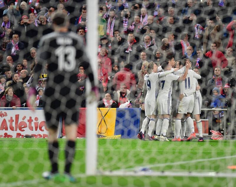 Real Madrid players celebrate after Cristiano Ronaldo opened the scoring. Pierre-Philippe Marcou / AFP