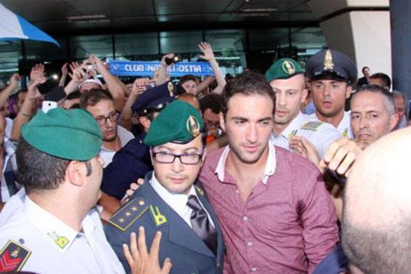 Gonzalo Higuain was welcomed at the airport on his arrival to have talks with Napoli.
