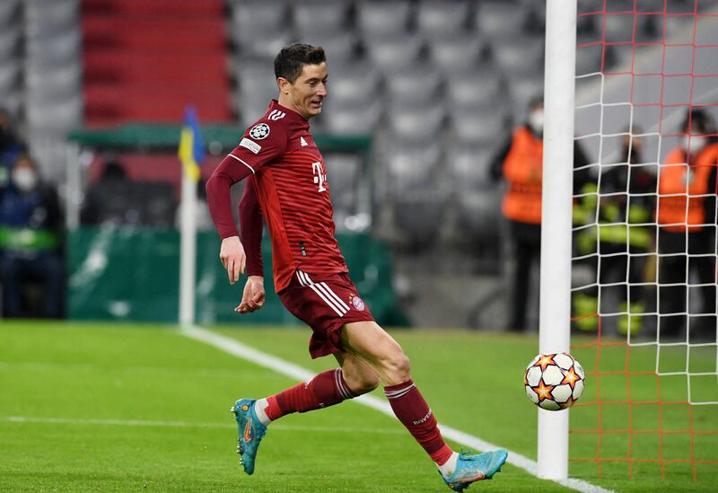 Bayern Munich's Robert Lewandowski scores their second goal. Reuters