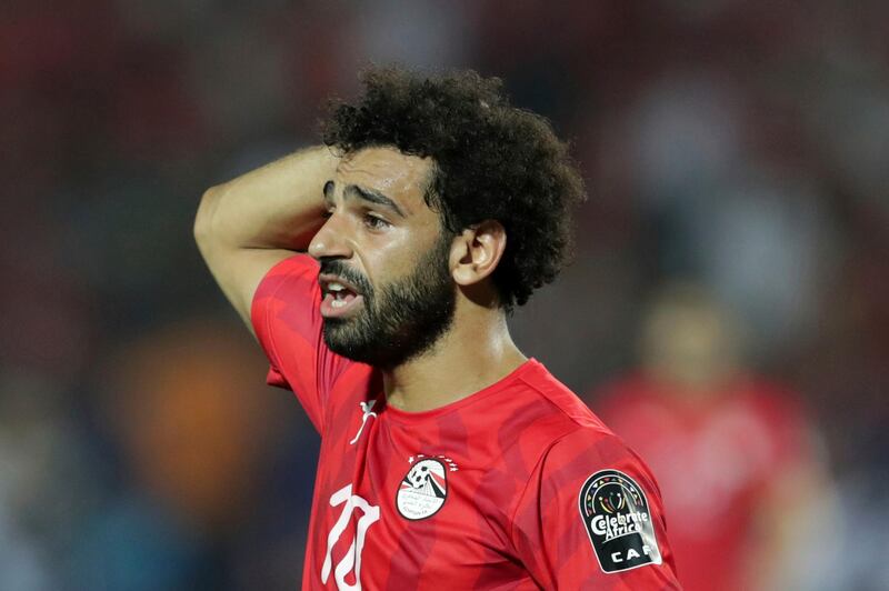 Egypt's Mohamed Salah walks in dejection end of the African Cup of Nations round of 16 soccer match between Egypt and South Africa in Cairo International stadium in Cairo, Egypt, Saturday, July 6, 2019. South Africa won 1-0. (AP Photo/Hassan Ammar)