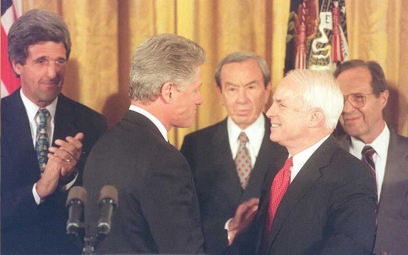 US President Bill Clinton (2nd-L) talks to Senator John McCain (2nd-R) after announcing that the US is establishing normal relations with  communist Vietnam as Senator Bob Kerrey (L) D-NE  Secretary of State Warren Christopher (C) and Defense Secretary William Perry (R) look on during ceremonies at the White House in Washington, DC 11 July. Clinton pledged that the US would continue to press for a full accounting of more than 2,200 servicemen still listed as missing in Vietnam and neighboring countries.              AFP PHOTO / AFP PHOTO / JOYCE NALTCHAYAN