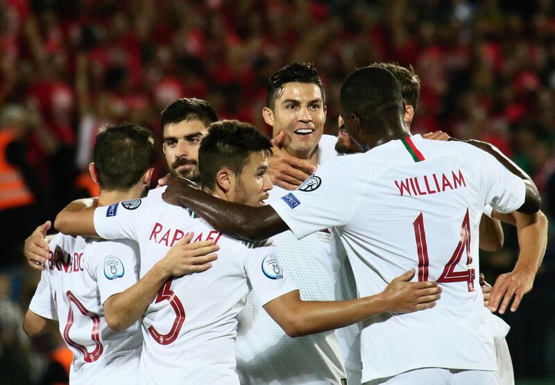 Portugal's forward Cristiano Ronaldo celebrates with teammates. AFP