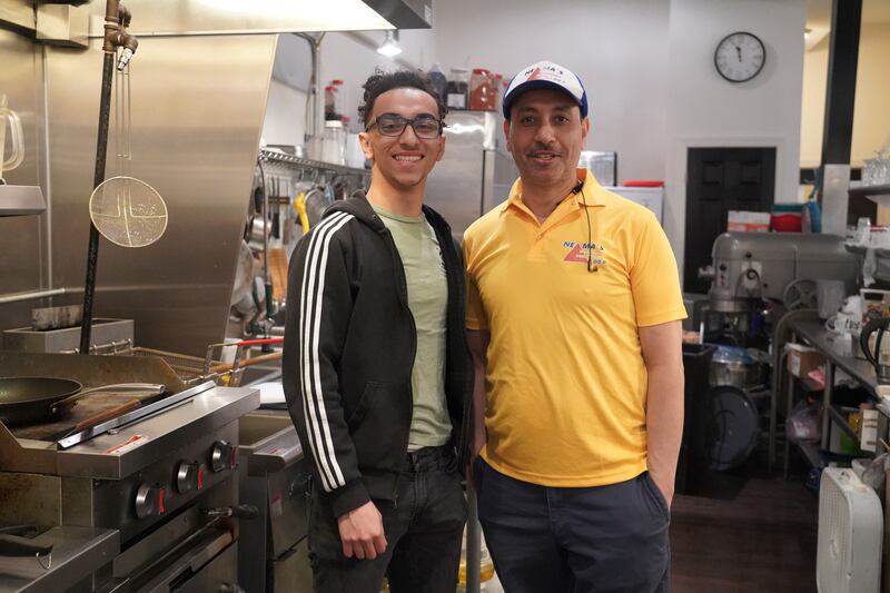 Youssef Ibrahim and his son Felo pose in the kitchen of their family restaurant in York, Pennsylvania. Willy Lowry / The National.