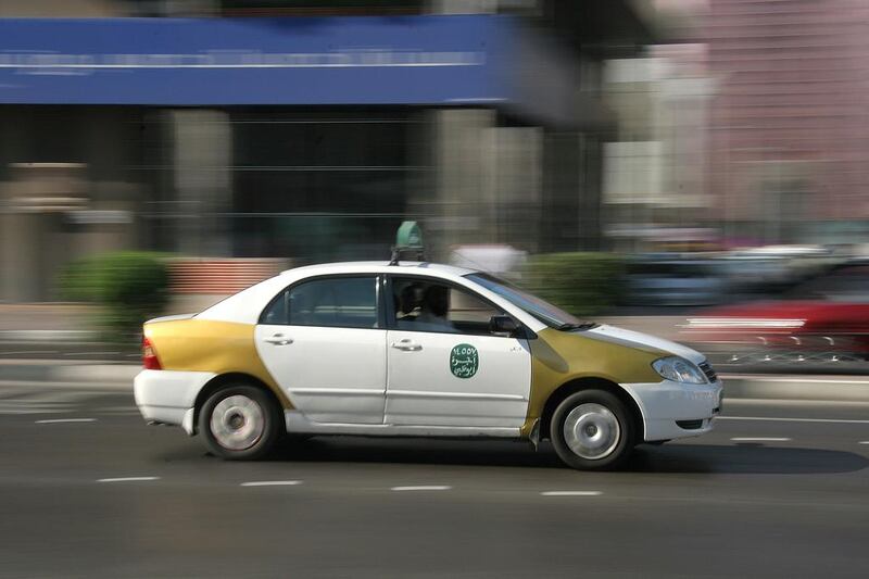 Six years ago, most of the taxis in Abu Dhabi were of the old white-and-gold variety rather than the professional fleet of silver taxis now. Photo: Philip Cheung / The National




