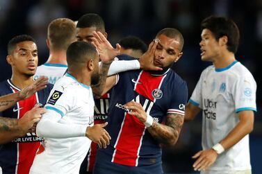 Soccer Football - Ligue 1 - Paris St Germain v Olympique de Marseille - Parc des Princes, Paris, France - September 13, 2020 Olympique de Marseille's Jordan Amavi clashes with Paris St Germain's Layvin Kurzawa REUTERS/Gonzalo Fuentes TPX IMAGES OF THE DAY