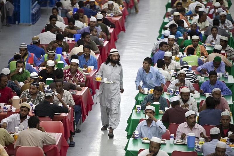 Men fill up the dining hall at the Saadiyat Accommodation Village on the Saadiyat Island in Abu Dhabi. Silvia Razgova / The National