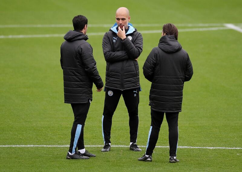 Manchester City manager Pep Guardiola, centre, at training on Tuesday. Reuters