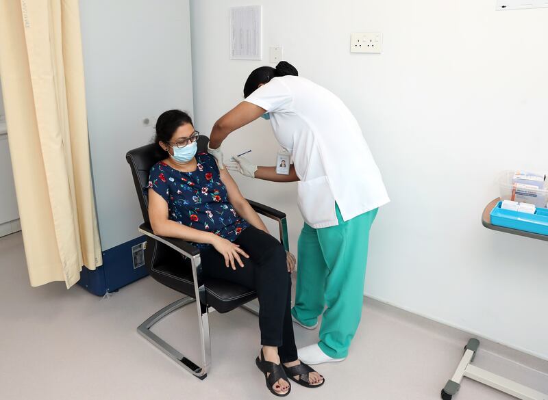 Fiji Antony receives her Pfizer Covid-19 vaccine at the NMC Royal Hospital DIP. Chris Whiteoak / The National