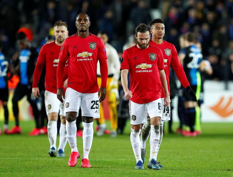 Manchester United's Juan Mata alongside Odion Ighalo and Jesse Lingard at the end of the match against Brugge. Reuters
